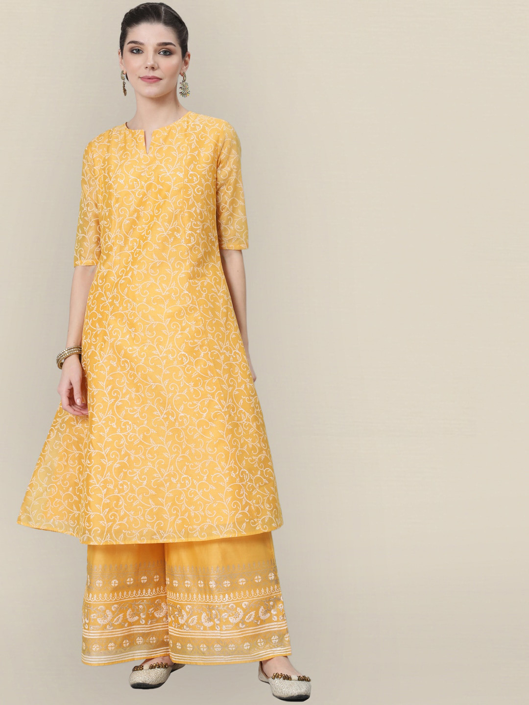 

Sangria Women Yellow Ethnic Motifs Printed Panelled Kurta with Palazzos