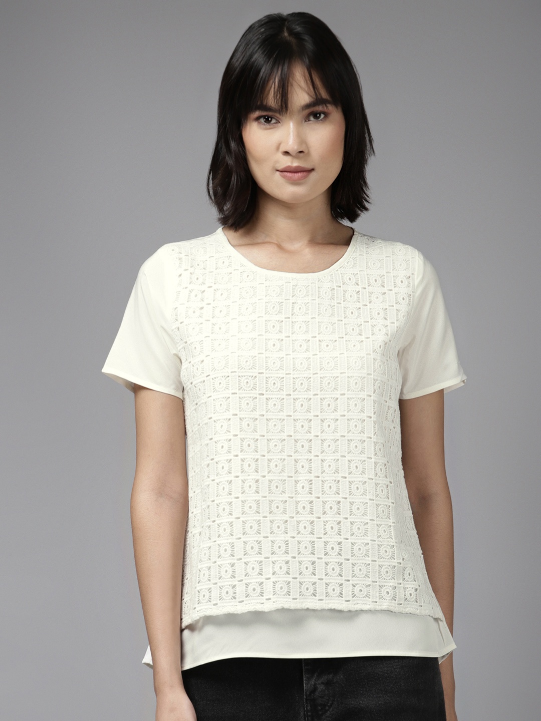 

Aarika Off White Self Design Layered Top