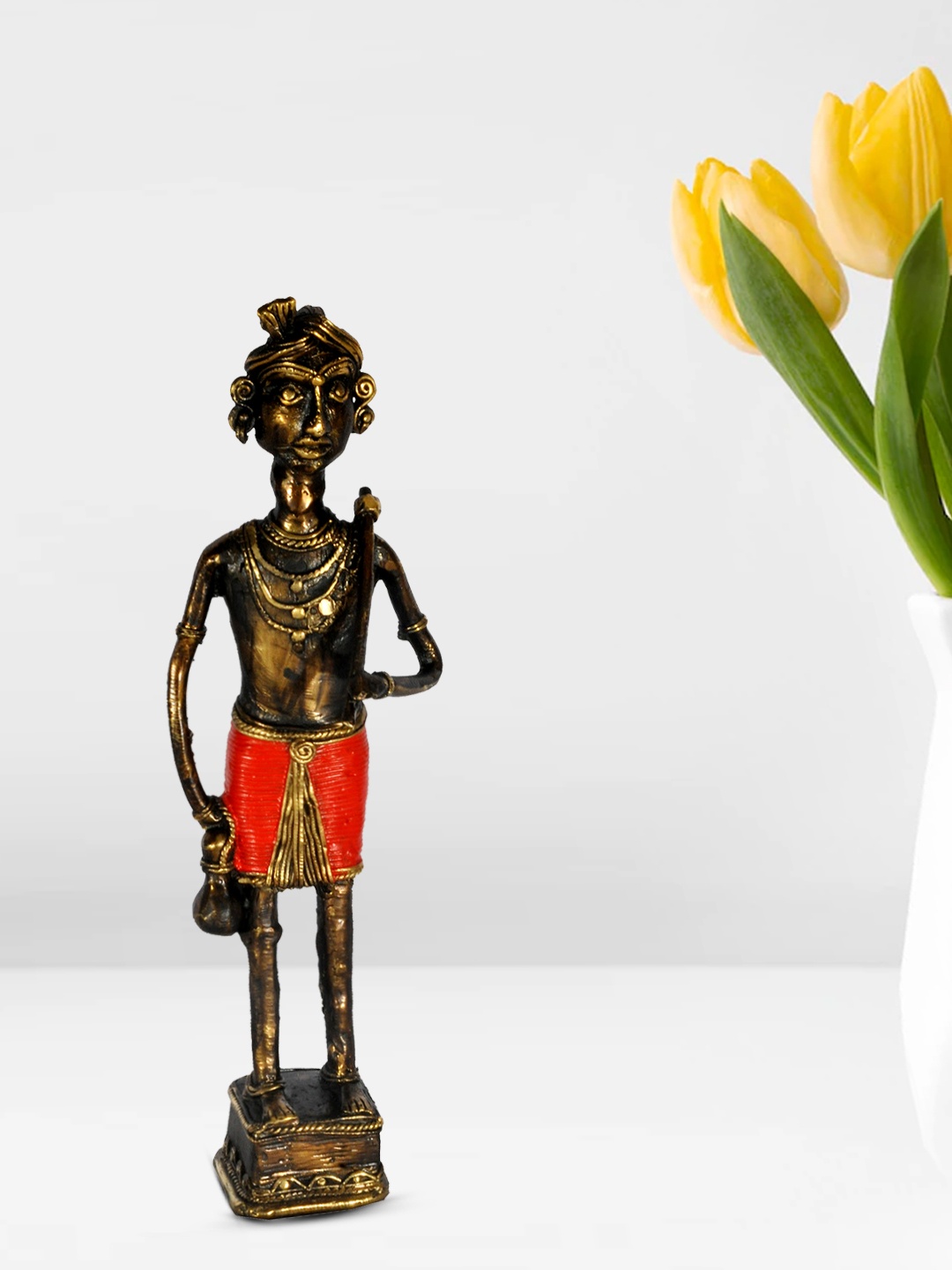 

SHREE KALA HOME DECOR Bronze & Red Tribal Man With Axe Showpiece