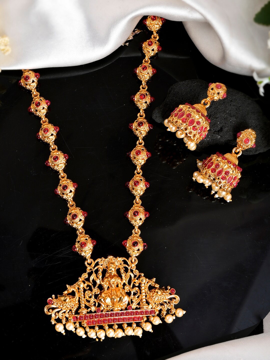 

Shoshaa Gold Toned and Plated Red Stone Studded Jewellery Set