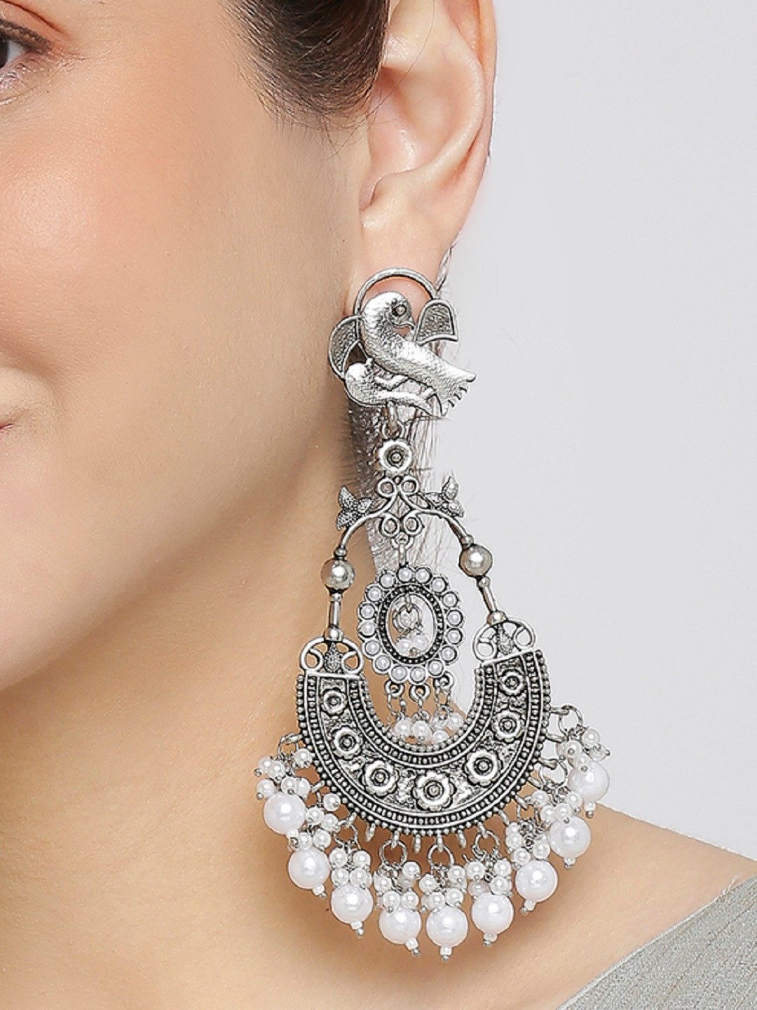 

OOMPH Silver Plated Peacock Shaped Chandbalis Earrings