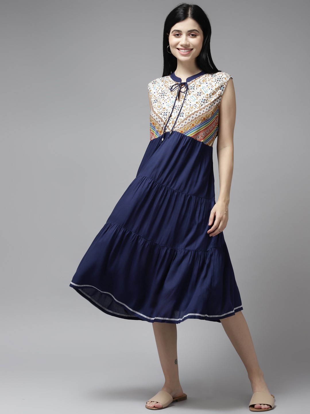 

Aarika Navy Blue & Beige Floral Tie-Up Neck Georgette A-Line Midi Dress