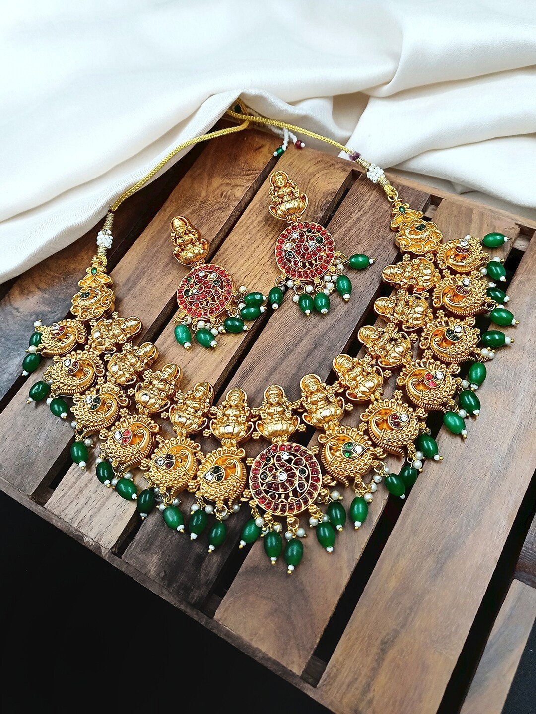 

StileAdda Gold-Plated Green Stone Studded & Beaded Temple Jewellery Set