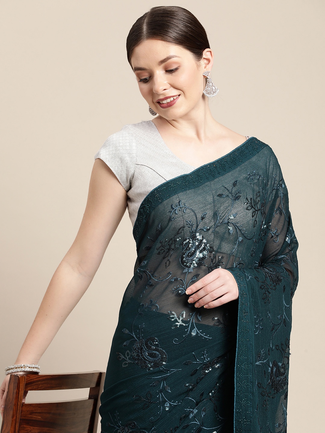 

Pothys Teal Ethnic Motifs Sequinned Pure Chiffon Saree