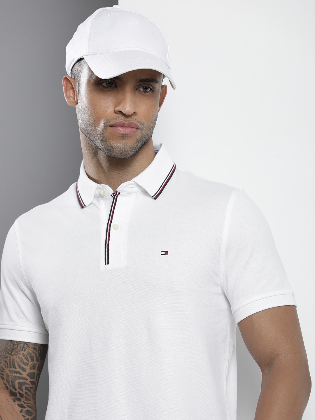 

Tommy Hilfiger Men White Solid Polo Collar T-shirt