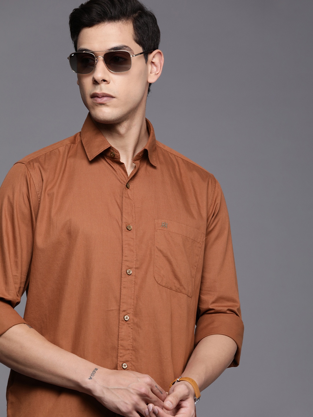 

Raymond Men Rust Brown Solid Slim Fit Pure Cotton Casual Shirt
