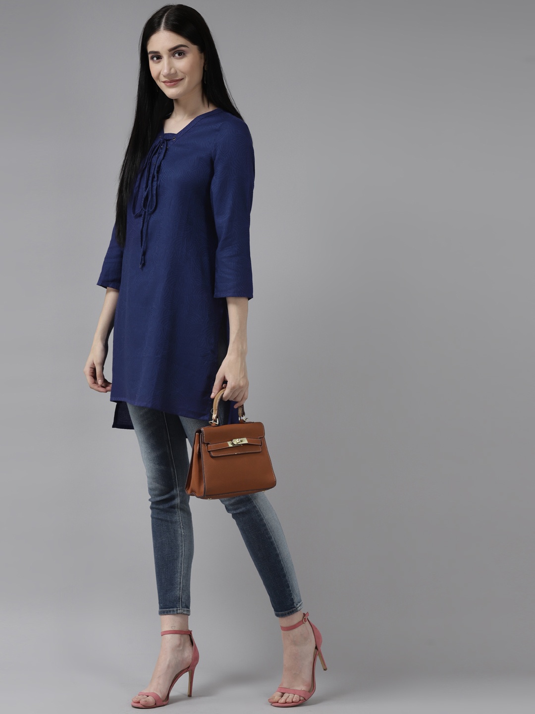

Aarika Navy Blue Print Tie-Up Neck Georgette High-Low Longline Top