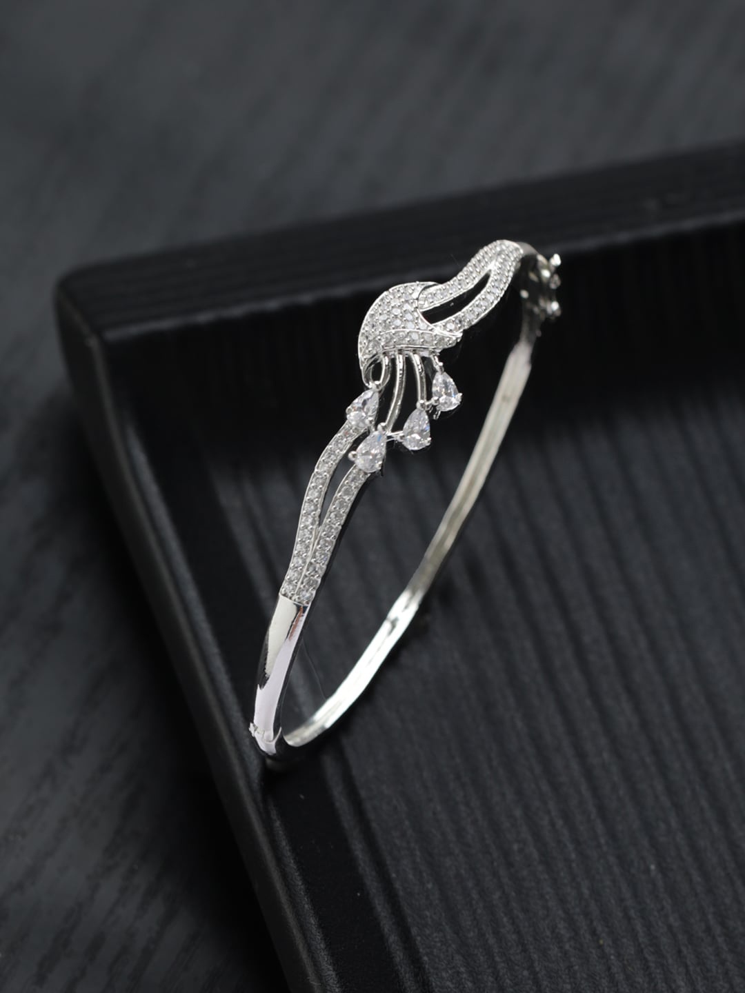 

Priyaasi Women American Diamond Silver-Plated Bangle-Style Bracelet
