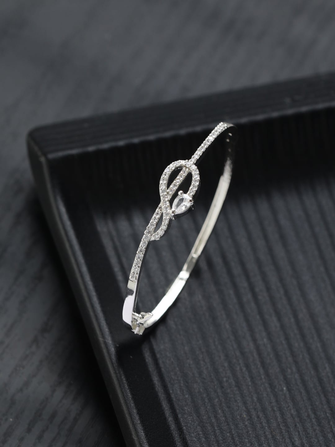 

Priyaasi Women Brass American Diamond Silver-Plated Bangle-Style Bracelet