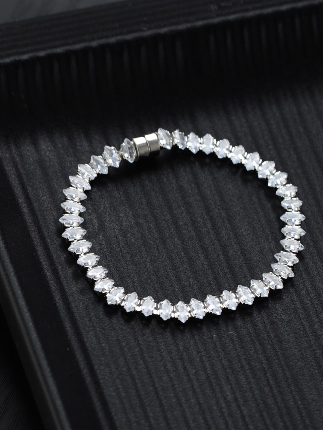 

Priyaasi Women Brass American Diamond Silver-Plated Link Bracelet