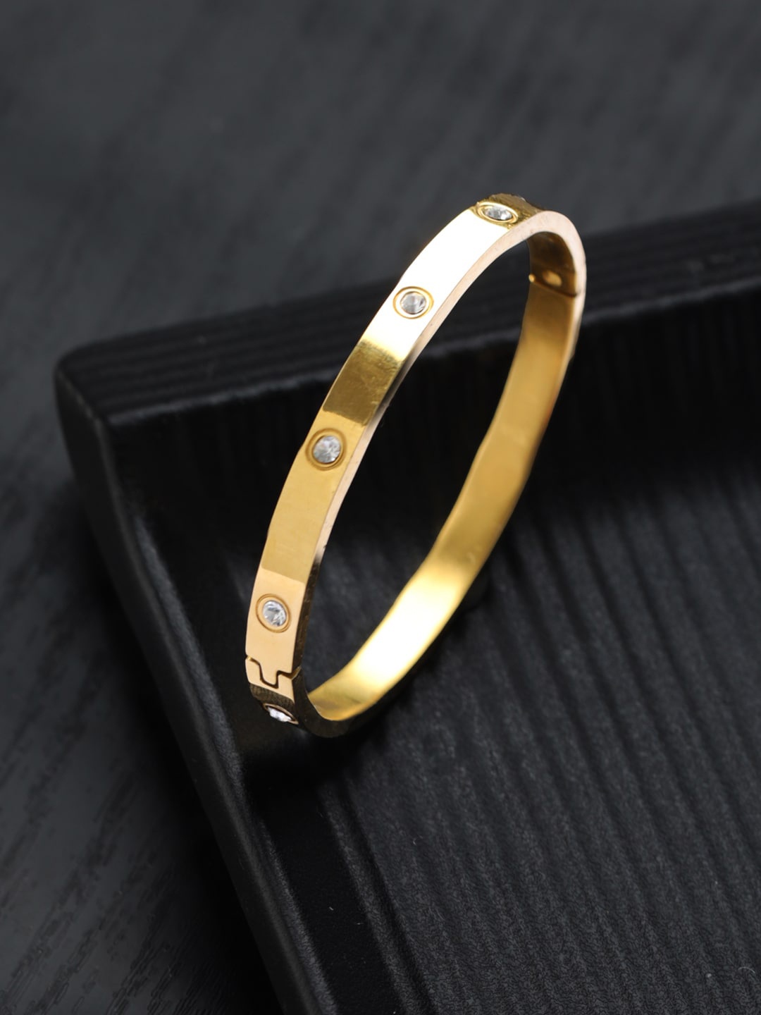 

Priyaasi Women Brass American Diamond Gold-Plated Bangle-Style Bracelet