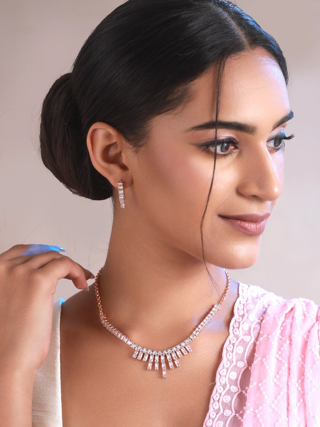 

Priyaasi Rose Gold Toned And White Rose Gold Plated Geometric AD Studded Jewellery Set