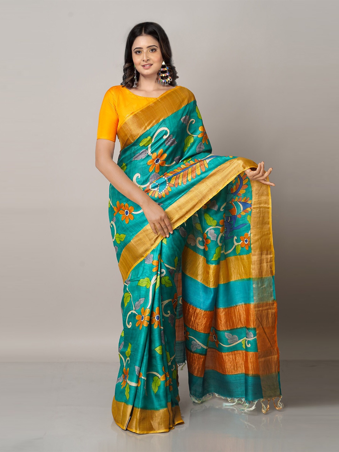 

Unnati Silks Green & Mustard Floral Zari Pure Silk Tussar Saree
