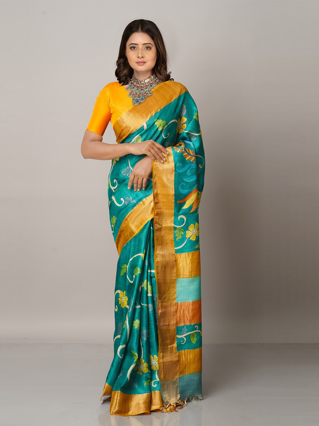 

Unnati Silks Green & Gold-Toned Floral Zari Pure Silk Tussar Saree