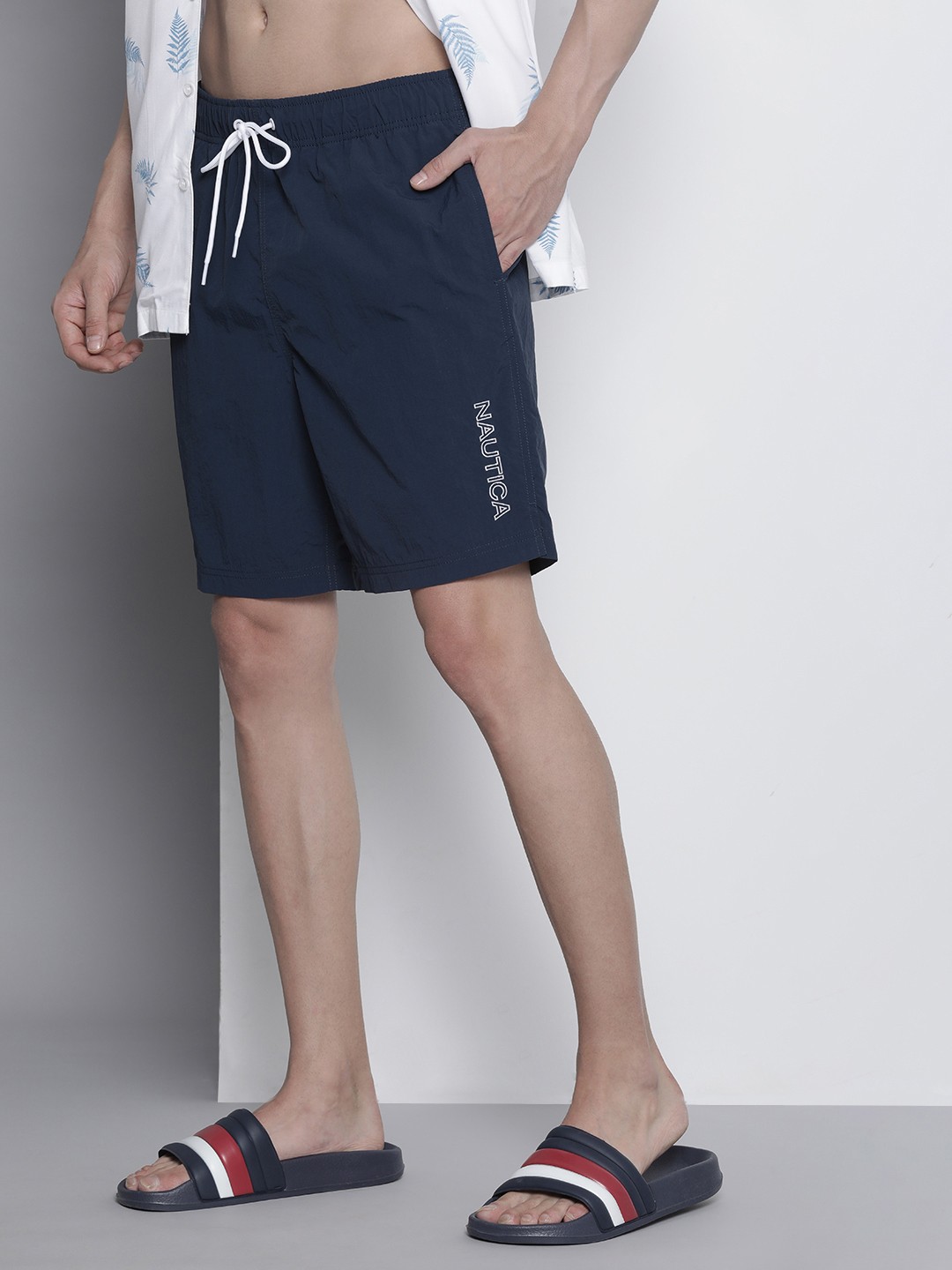 

Nautica Men Solid Mid Rise Above Knee Swim Shorts, Navy blue