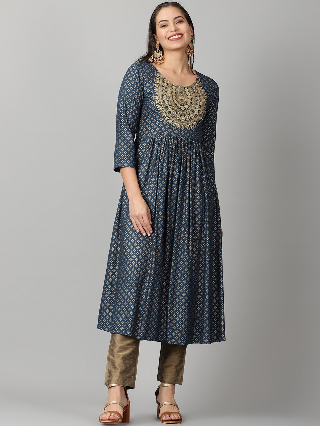 

Saffron Threads Women Teal Ethnic Foil Print Zari Neck Empire Design Kurta