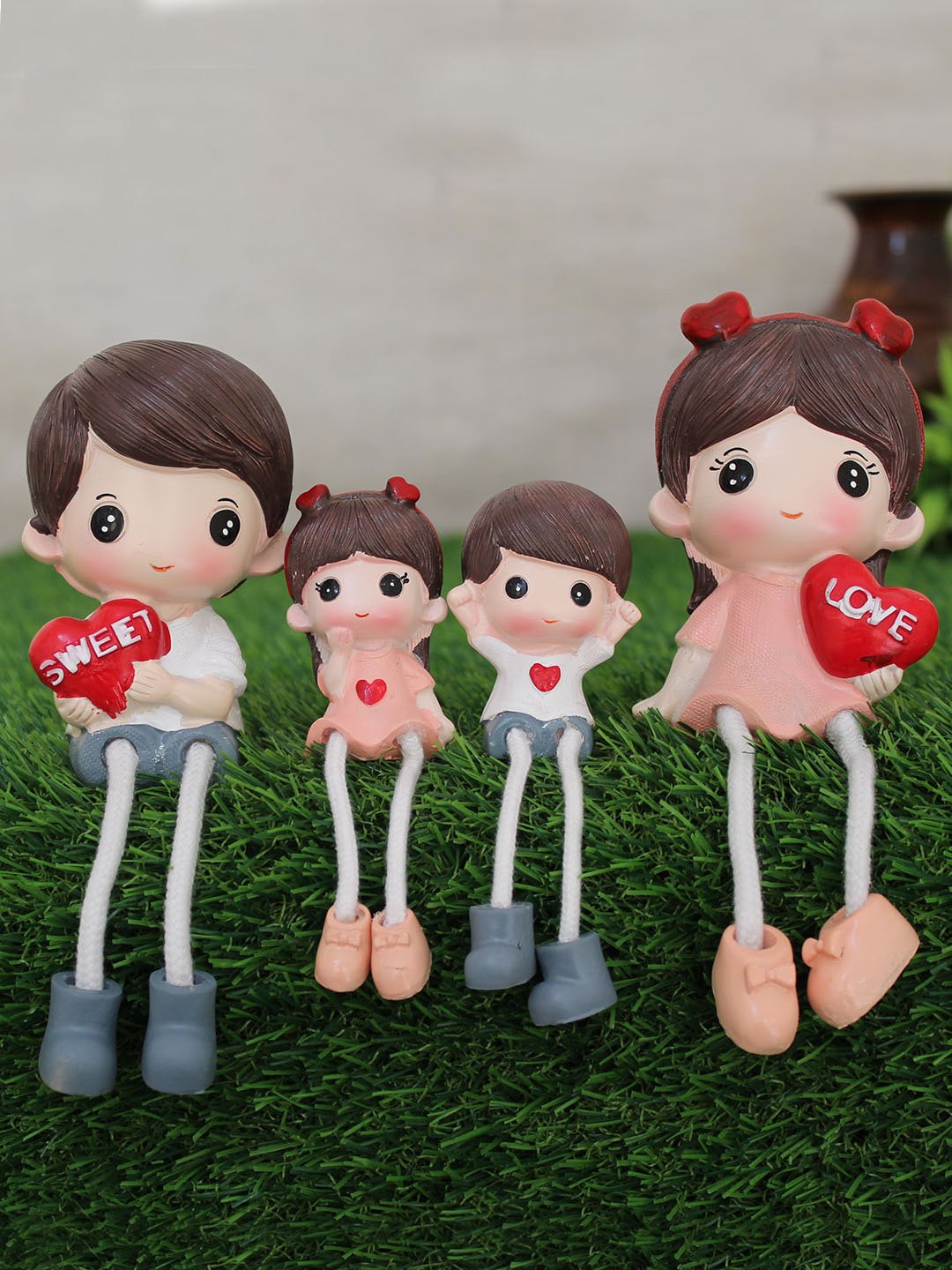 

TIED RIBBONS Set Of 4 Pink & White Long Leg Family Couple With Kid Showpiece