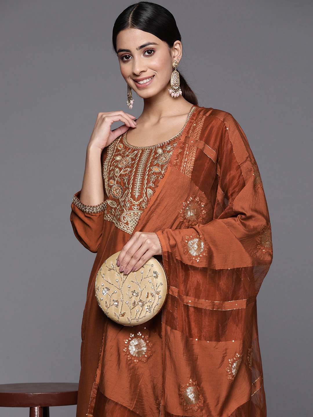 

Indo Era Women Rust Floral Yoke Design Sequinned Kurta with Trousers & With Dupatta