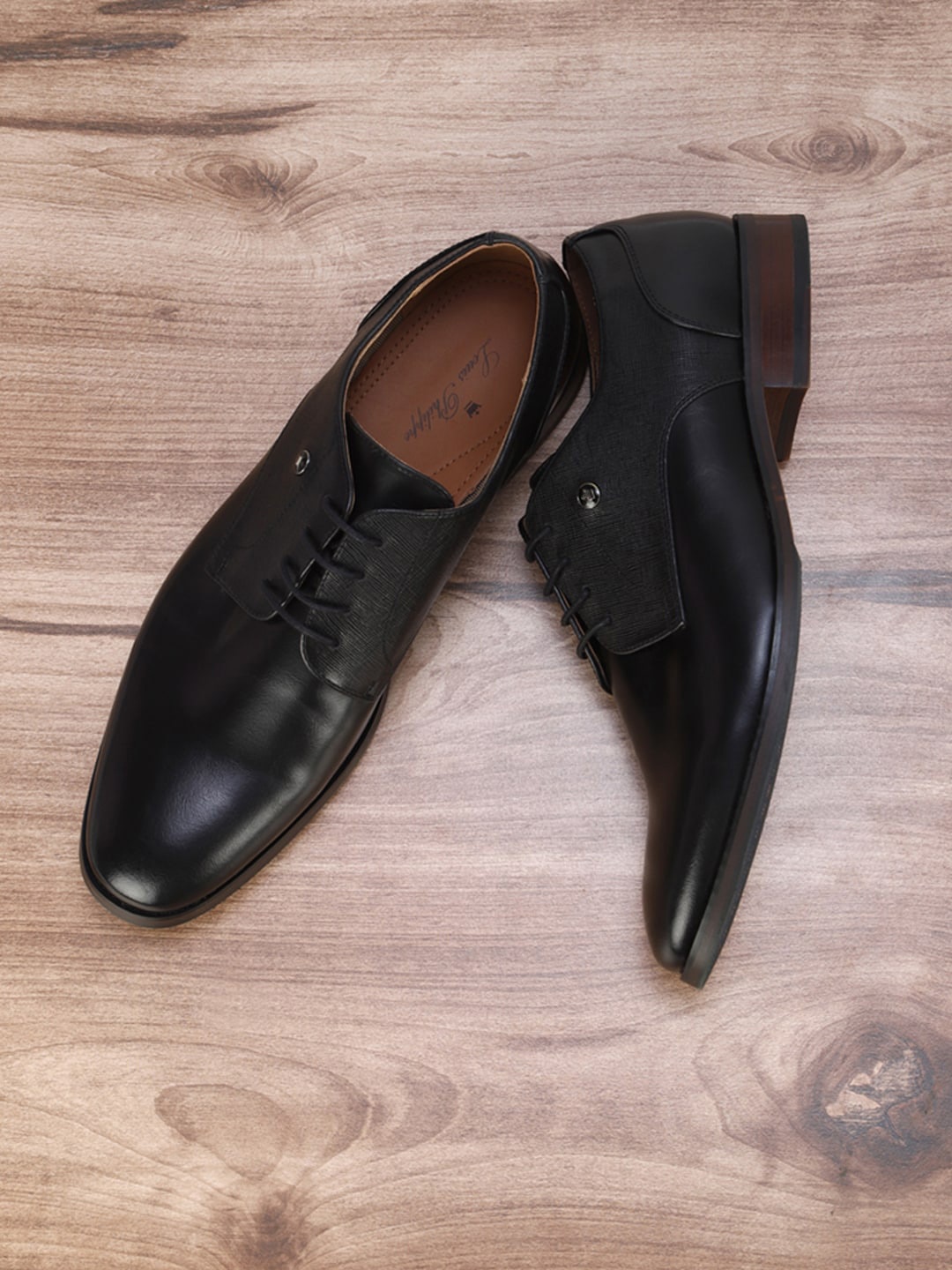 

Louis Philippe Men Black Solid Formal Loafers