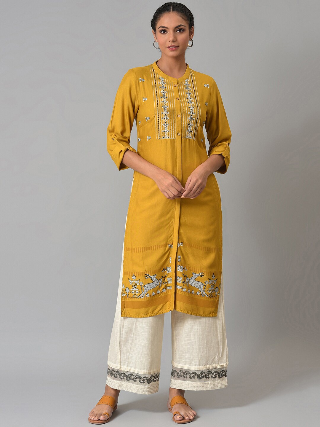 

W Women Yellow Ethnic Motifs Embroidered Kurta with Palazzos