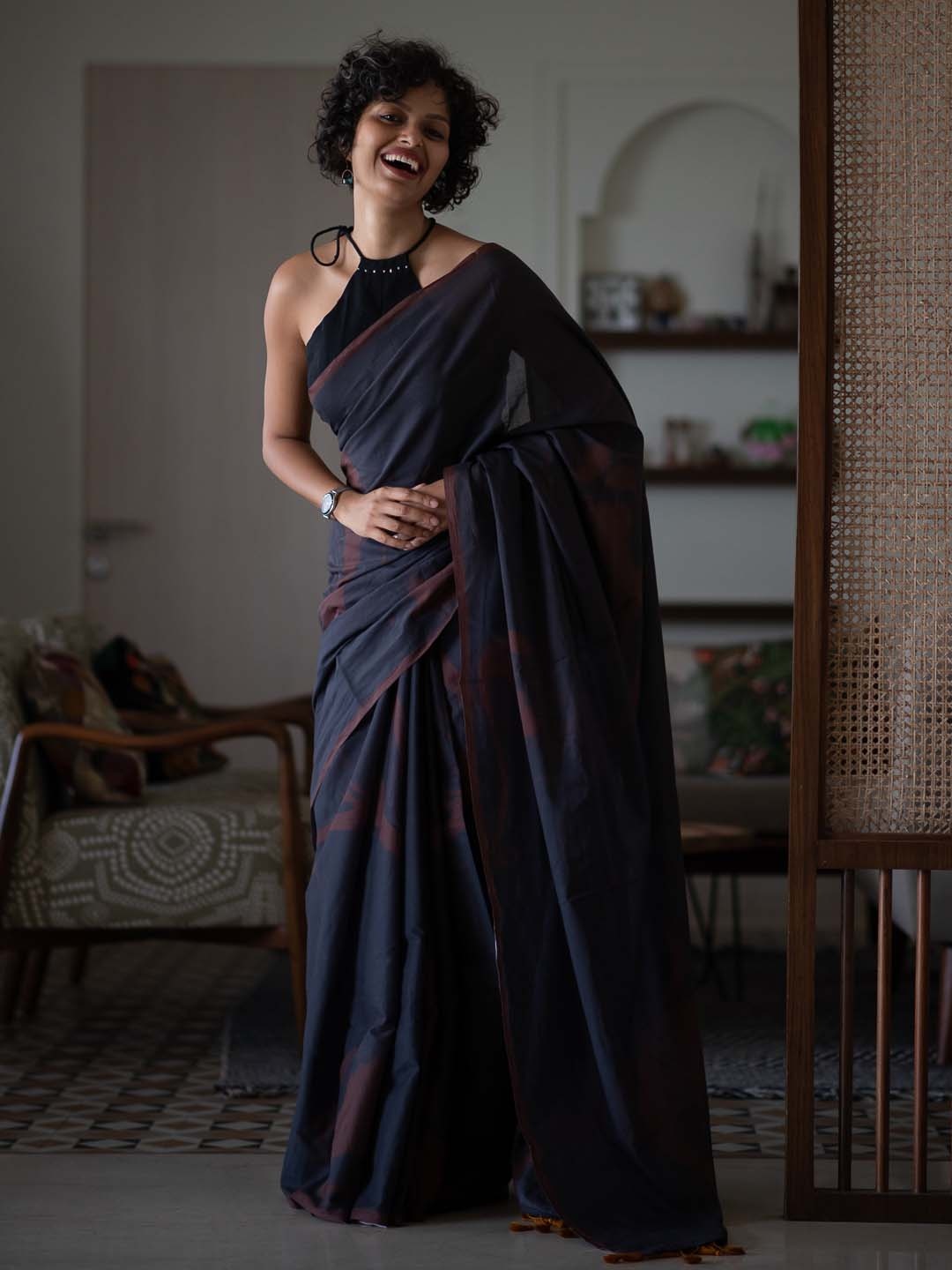 

Suta Black & Brown Abstract Printed Saree