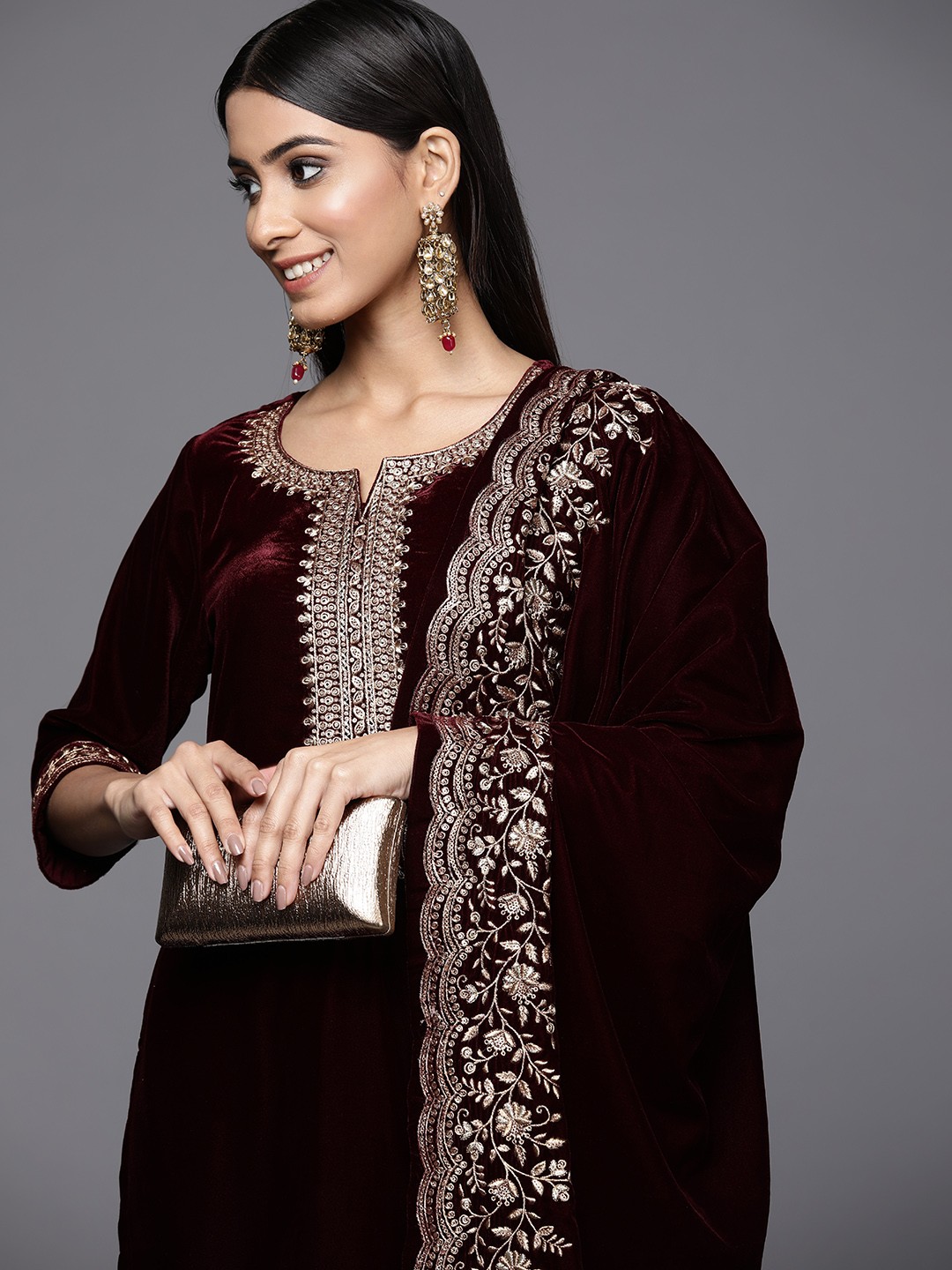 

Libas Women Burgundy Ethnic Motifs Embroidered Velvet Kurta with Trousers & With Dupatta