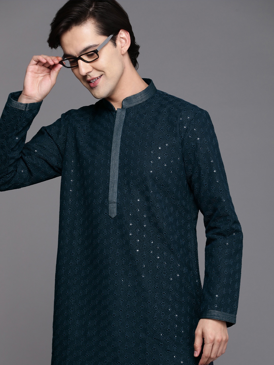 

Manyavar Men Navy Blue Ethnic Motifs Sequinned Silk Georgette Kurta with Churidar