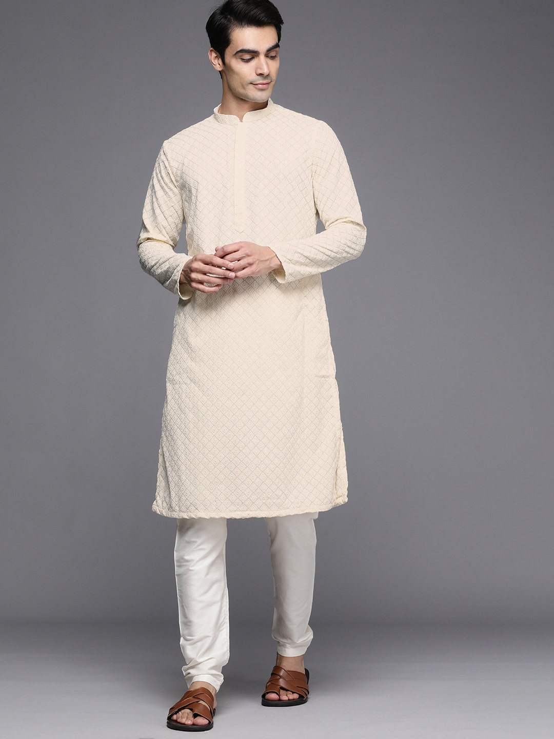 

Manyavar Men Cream-Coloured Ethnic Motifs Thread Work Kurta with Churidar