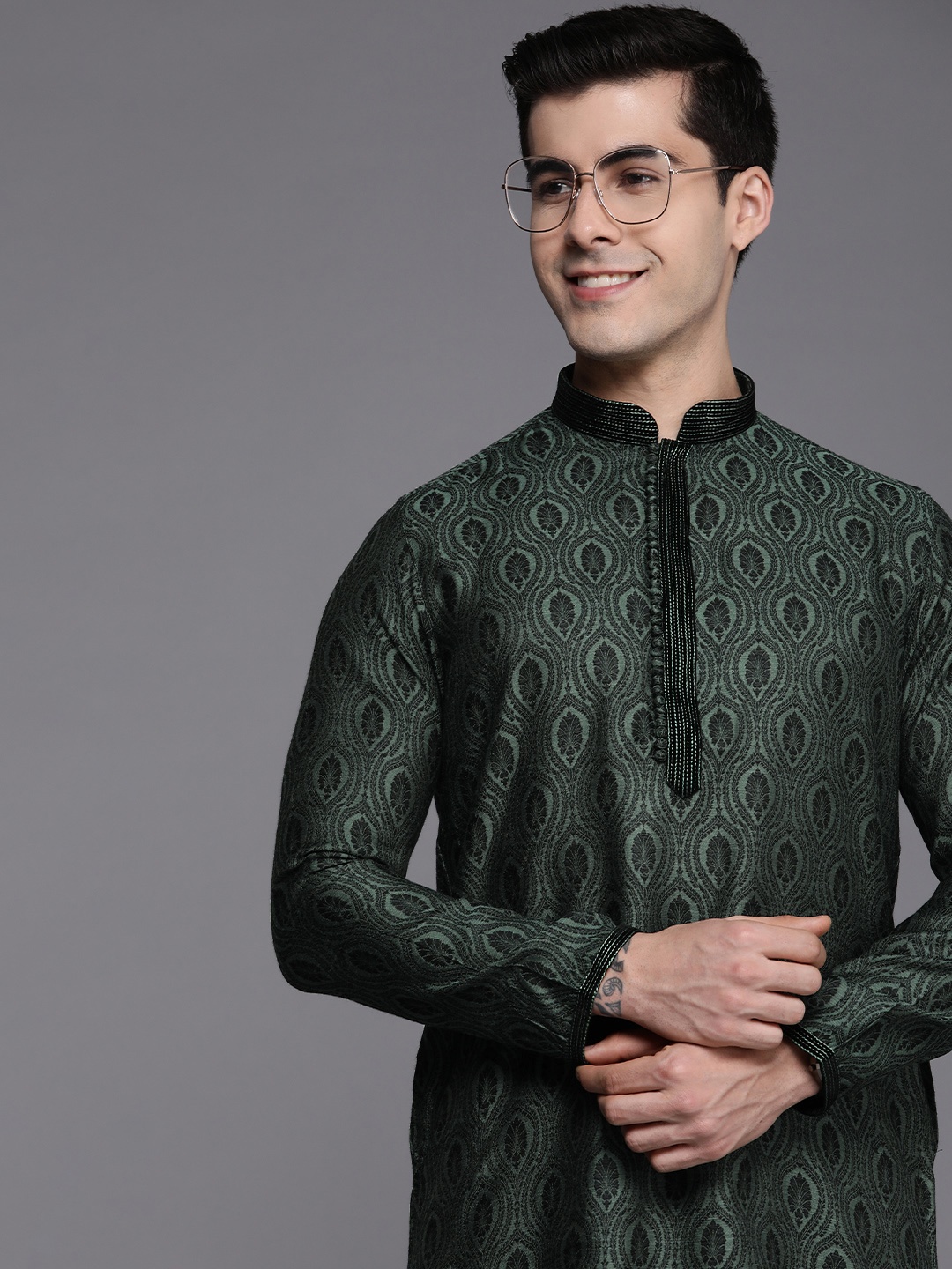 

Manyavar Men Green Ethnic Motifs Thread Work Kurta with Churidar