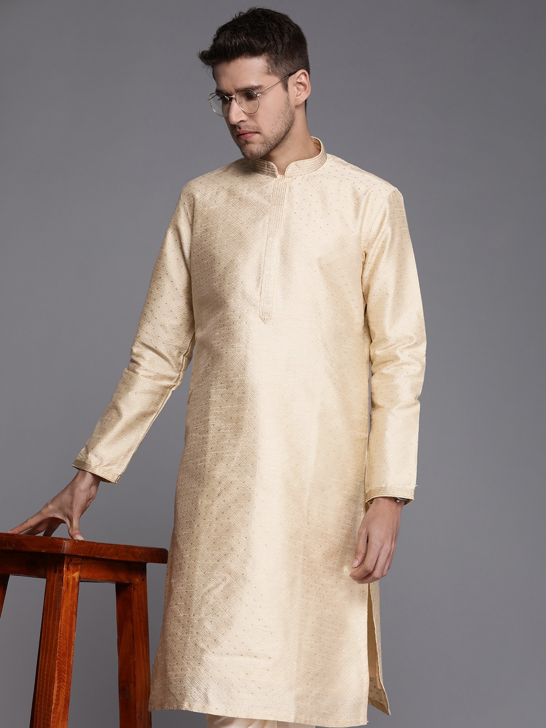 

Manyavar Men Beige Ethnic Motifs Thread Work Kurta with Churidar
