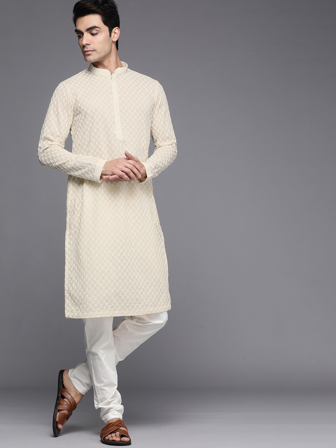 

Manyavar Men Off White Woven Design Kurta with Churidar