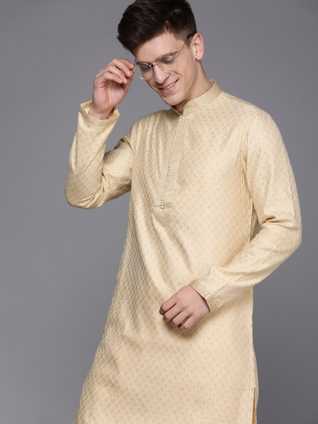 

Manyavar Men Beige Solid Kurta with Churidar