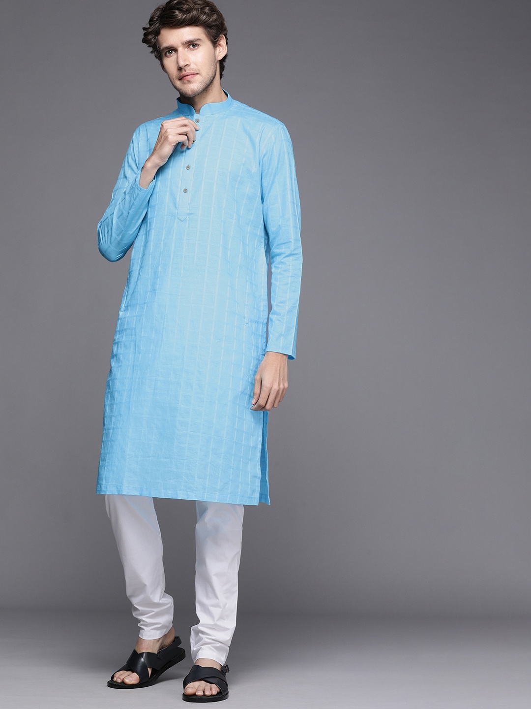 

Manyavar Men Blue Solid Kurta with Churidar