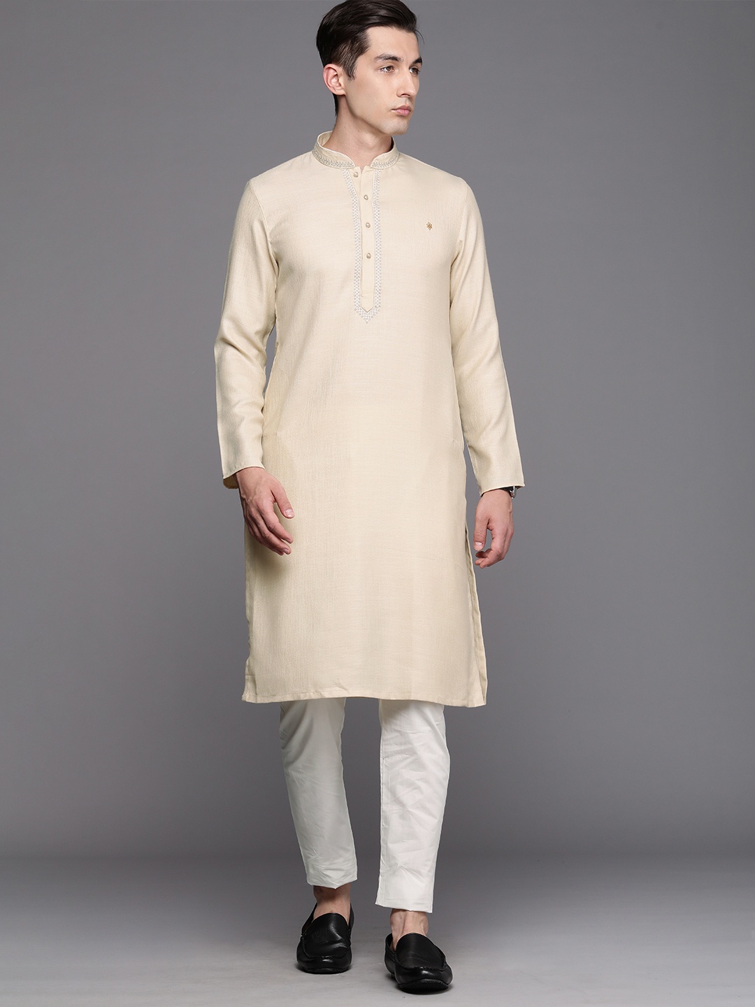 

Manyavar Men Beige Solid Kurta with Churidar