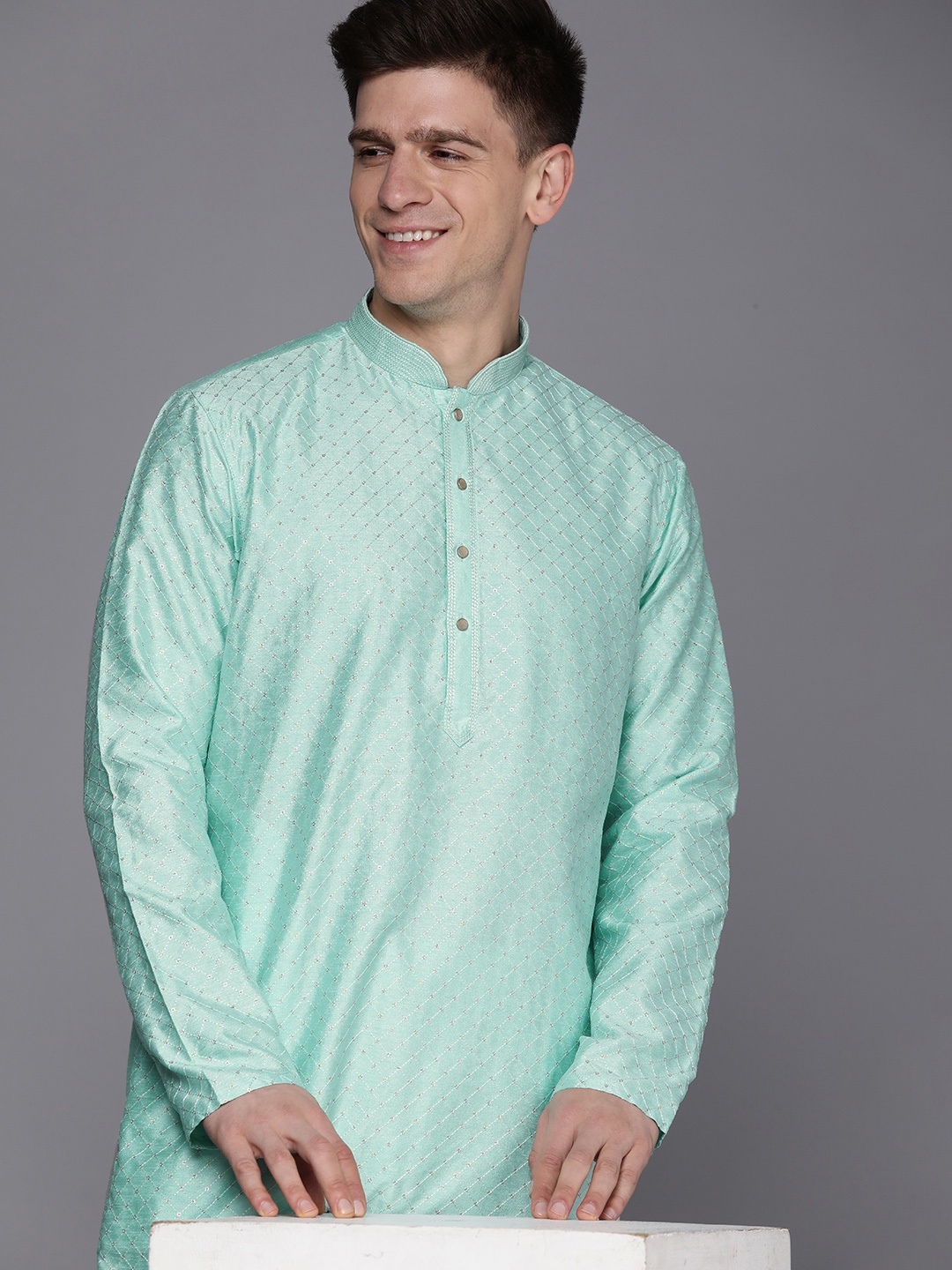 

Manyavar Men Sea Green Geometric Embroidered Kurta with Churidar