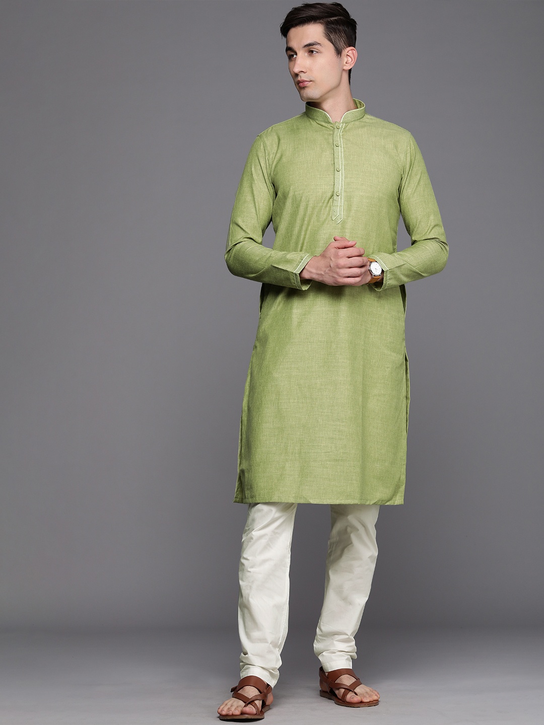 

Manyavar Men Green Solid Kurta with Churidar