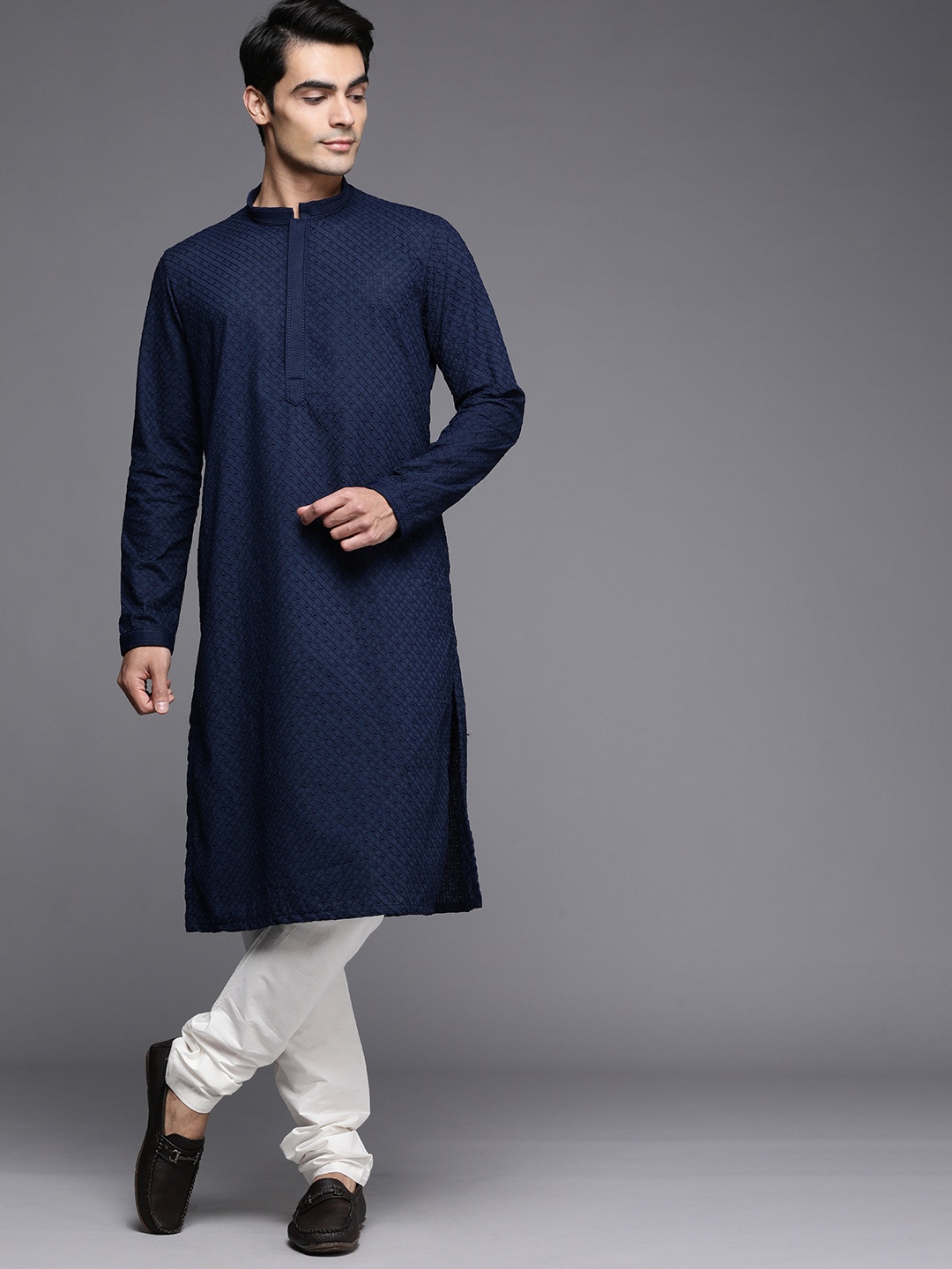 

Manyavar Men Navy Blue Ethnic Motifs Embroidered Kurta with Churidar