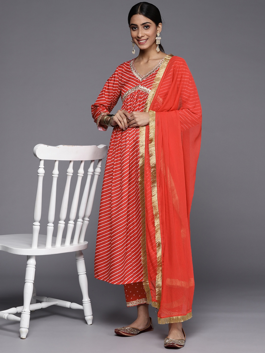 

Varanga Women Red Leheriya Embroidered Empire Kurta with Trousers & With Dupatta