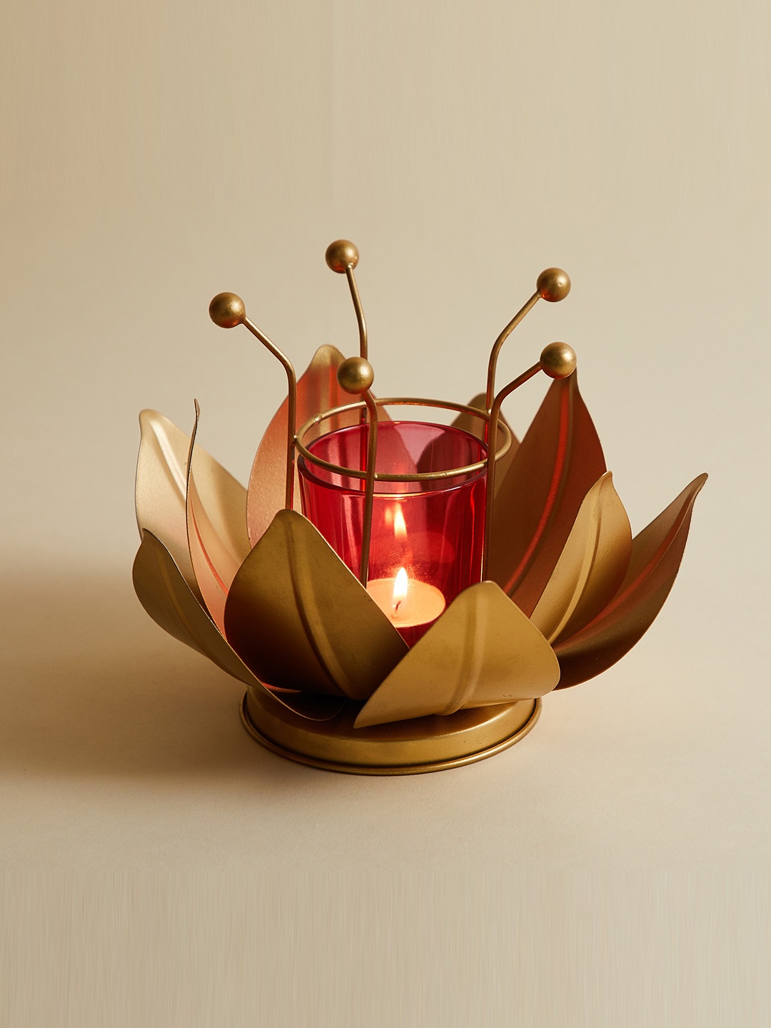 

Home Centre Gold-Toned Textured Metal Abstract Votive Holder