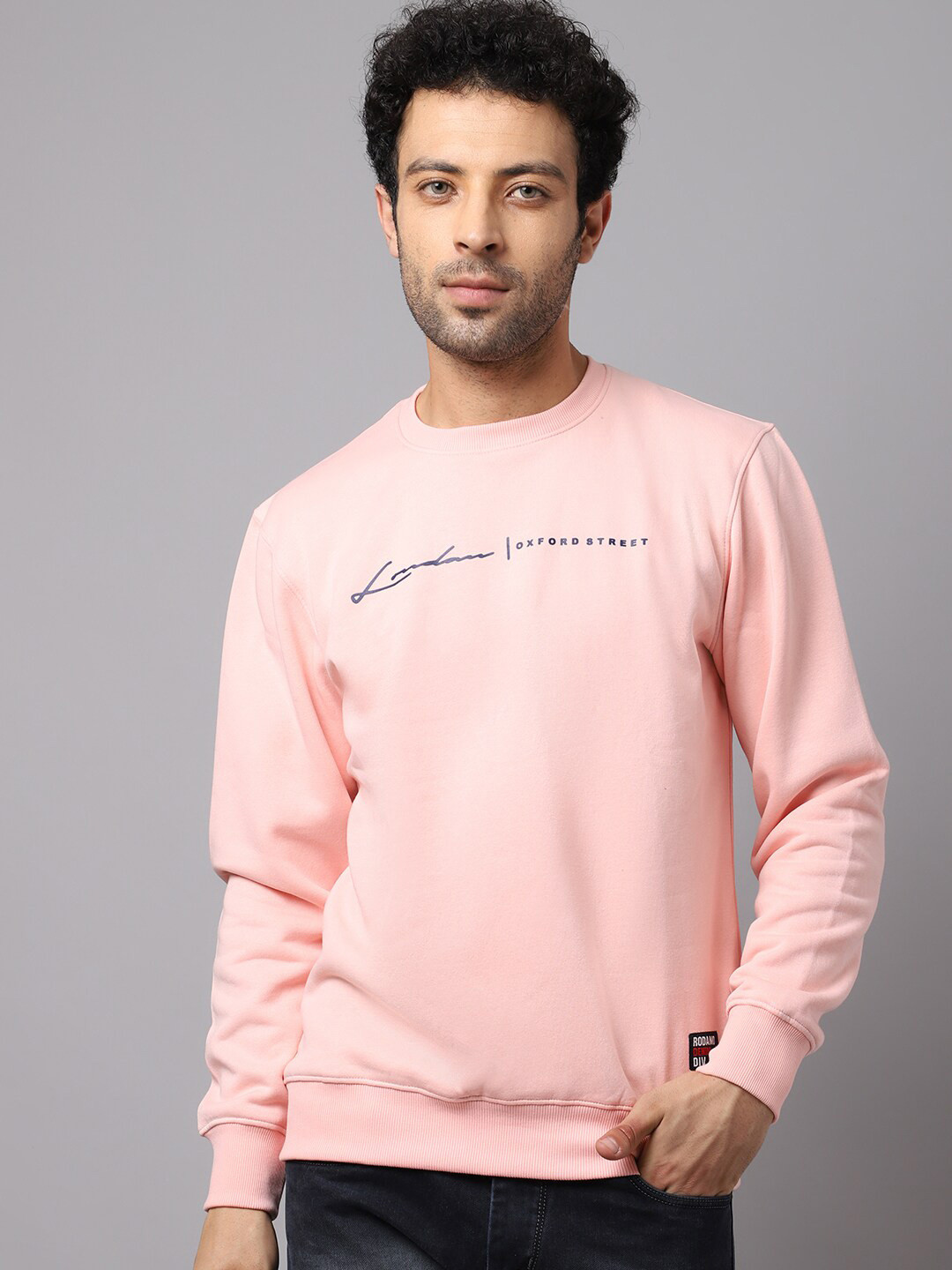 

Rodamo Men Peach-Coloured Solid Sweatshirt