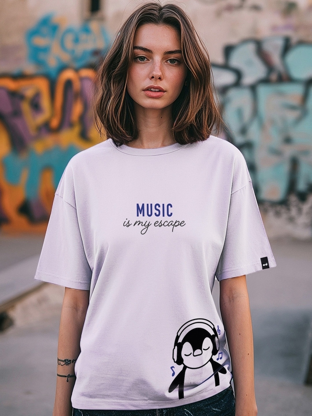 

Bewakoof Music Is My Escape Graphic Printed Drop-Shoulder Sleeves Cotton T-shirt, Purple