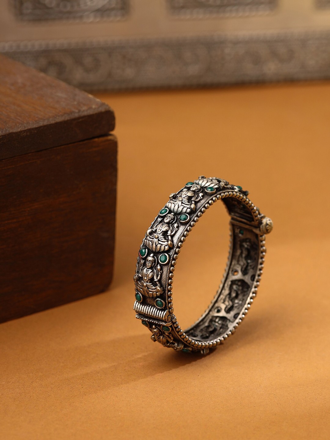 

Yellow Chimes Silver Green Stone Studded Lakshmi Designed Oxidised Bangle