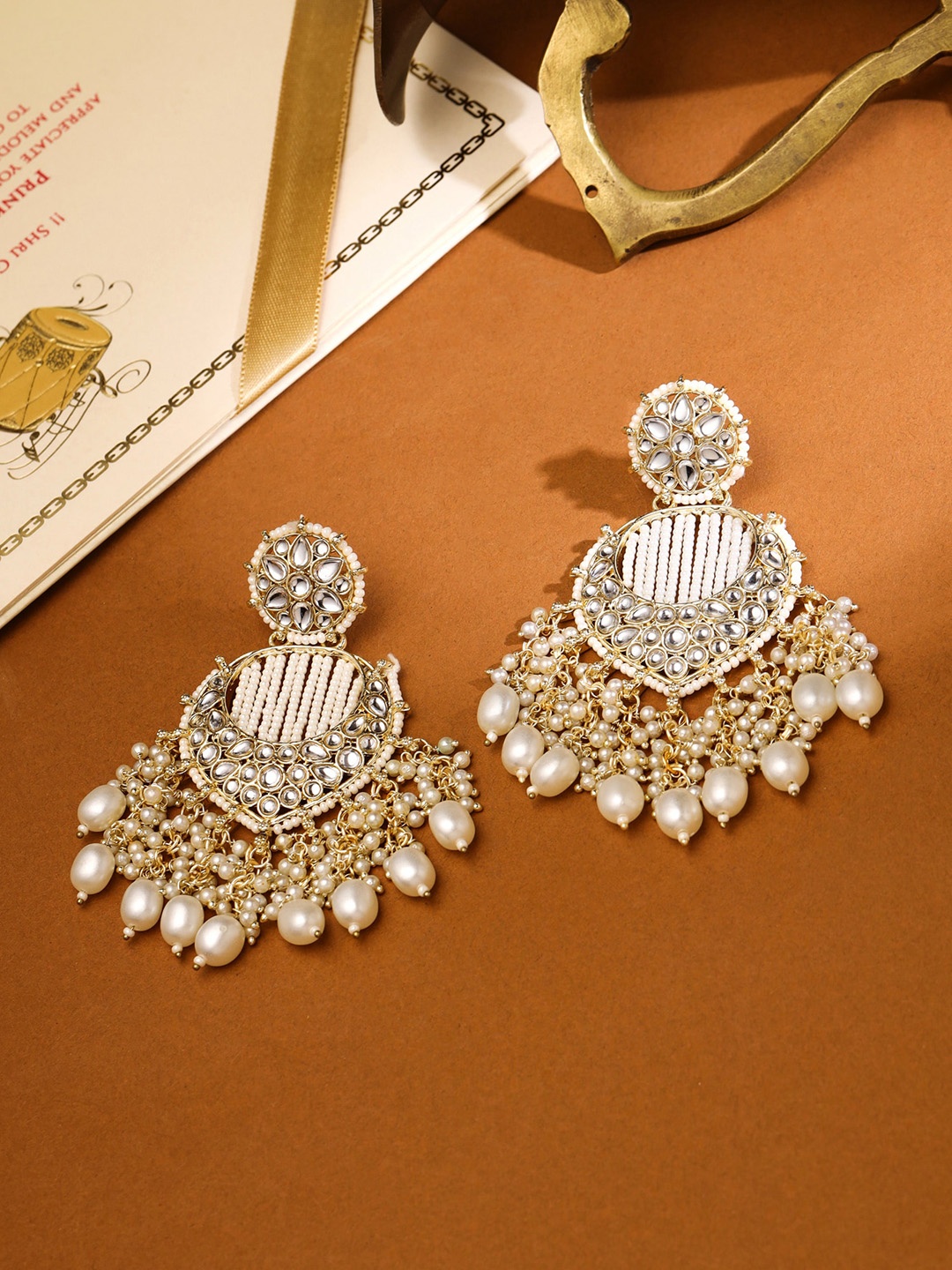 

Yellow Chimes Gold Plated Kundan Pearl Chandbalis Earrings, White