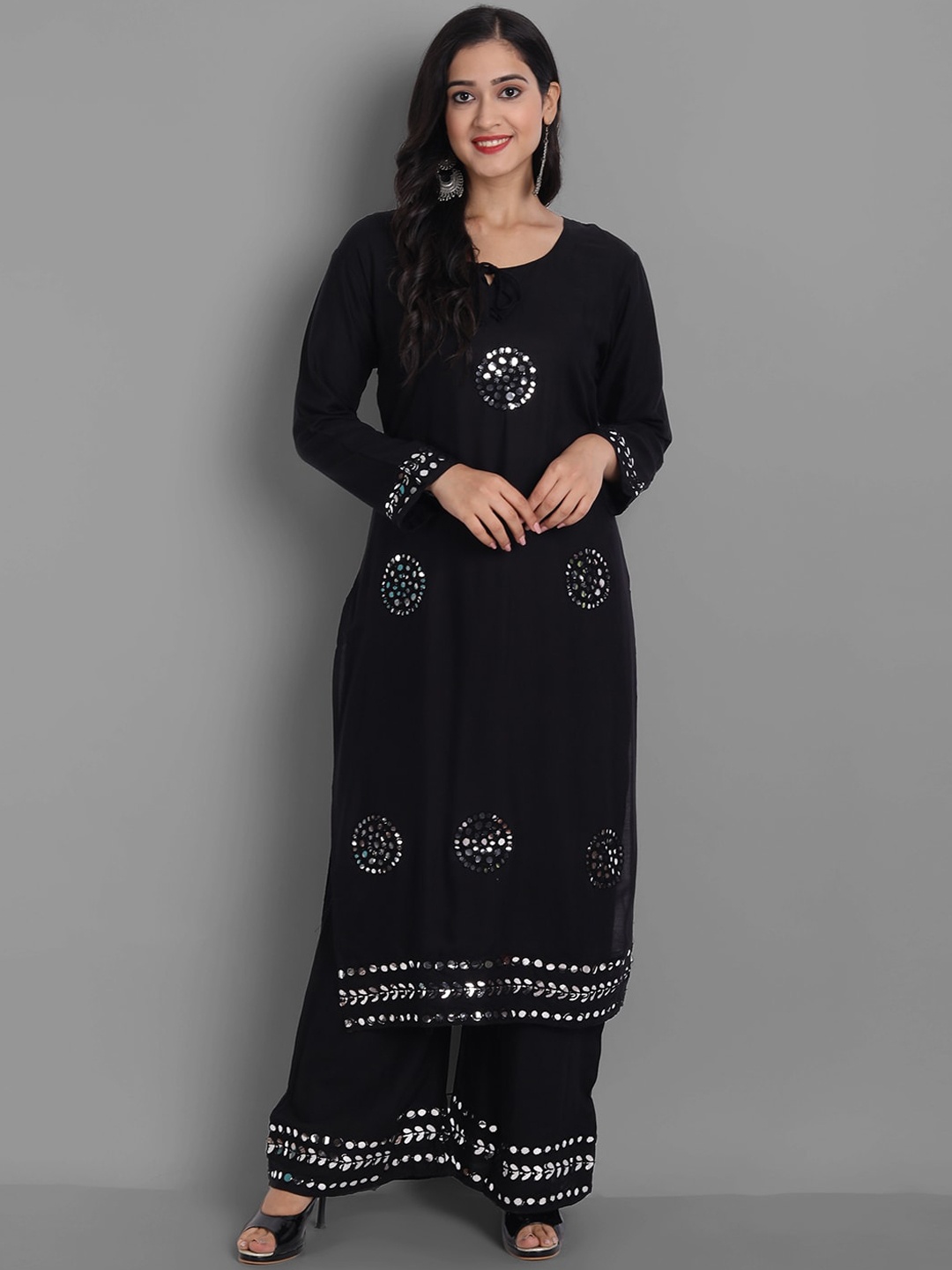 

Ziva Fashion Women Black Floral Embroidered Mirror Work Kurta with Palazzos