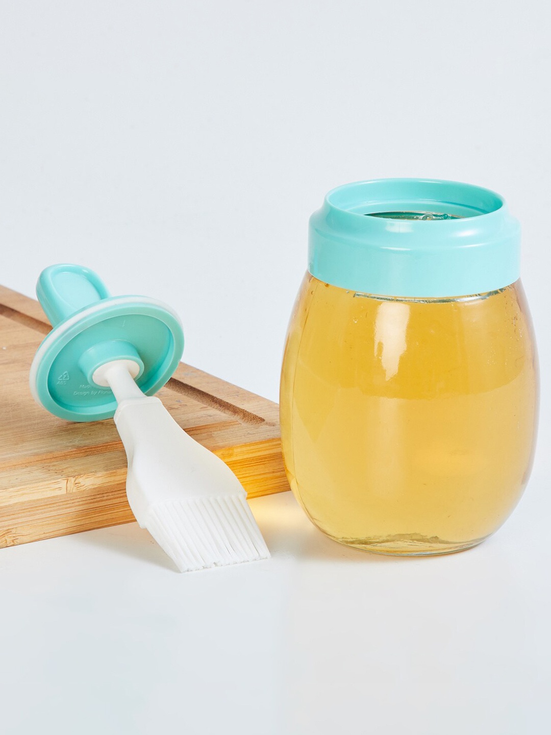 

Home Centre Transparent Glass Jar with Silicon Drip Brush