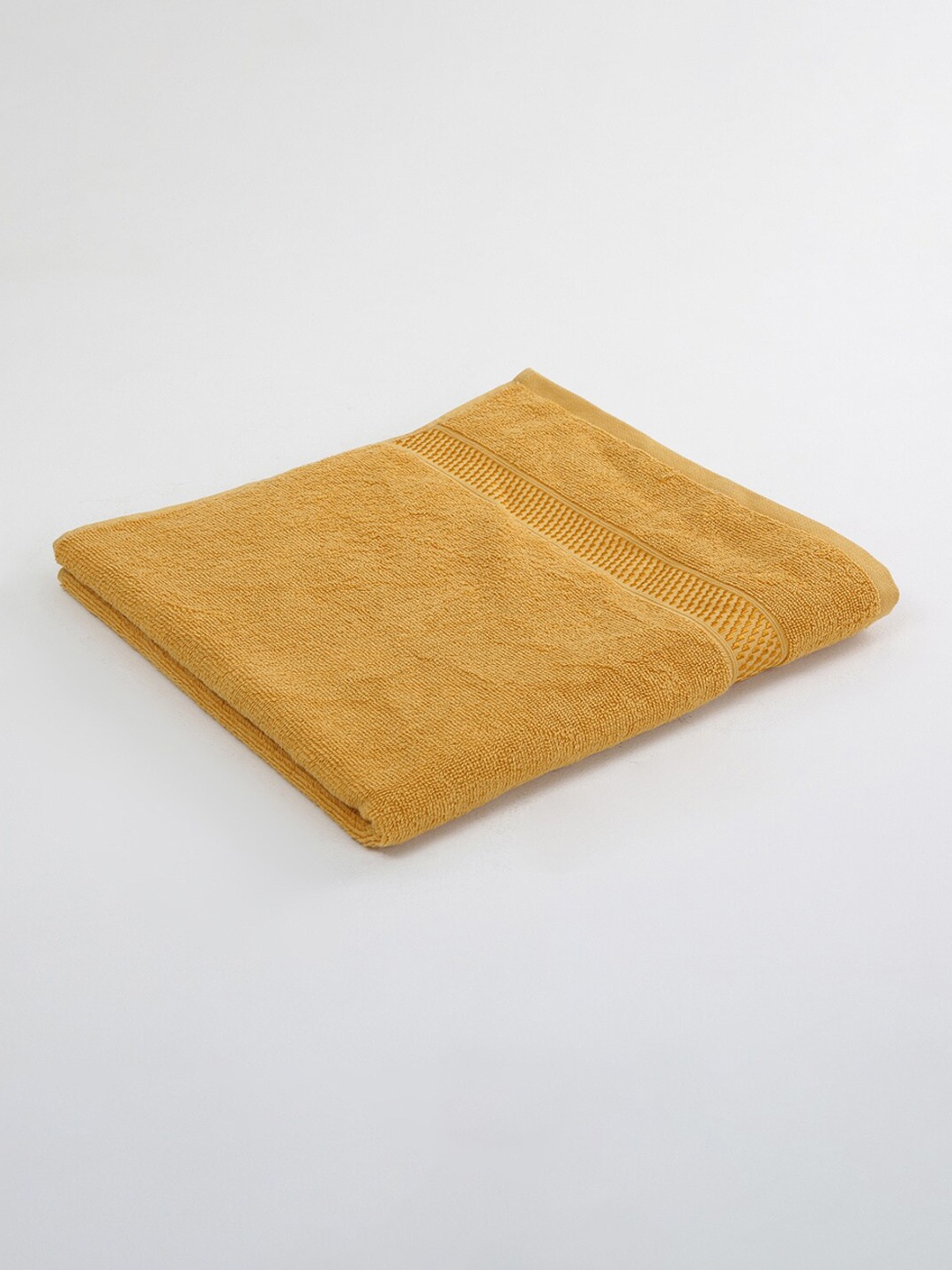 

Home Centre Yellow Solid 380 GSM Cotton Bath Towels