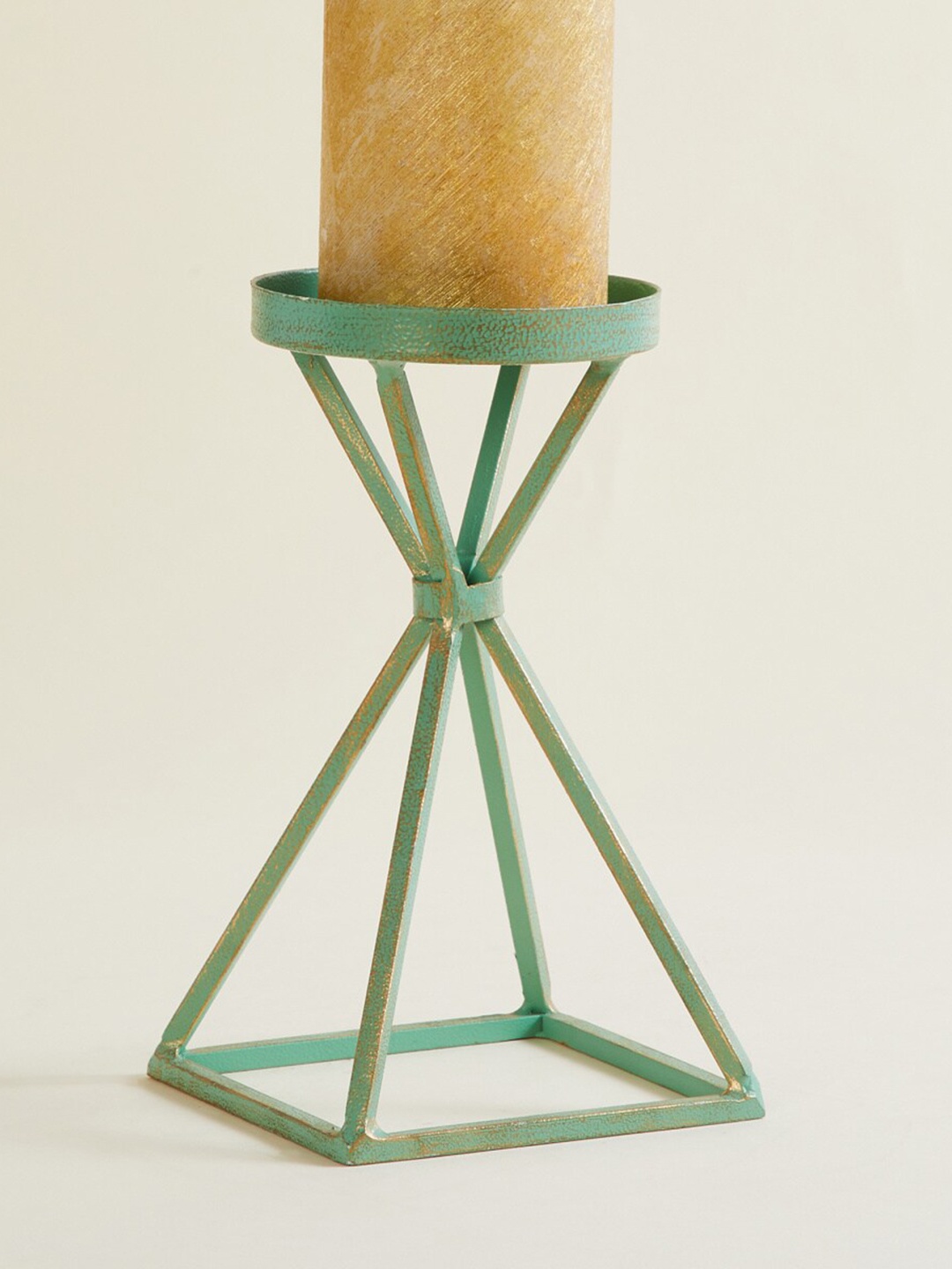 

Home Centre Teal Green Solid Hammered Candle Holder
