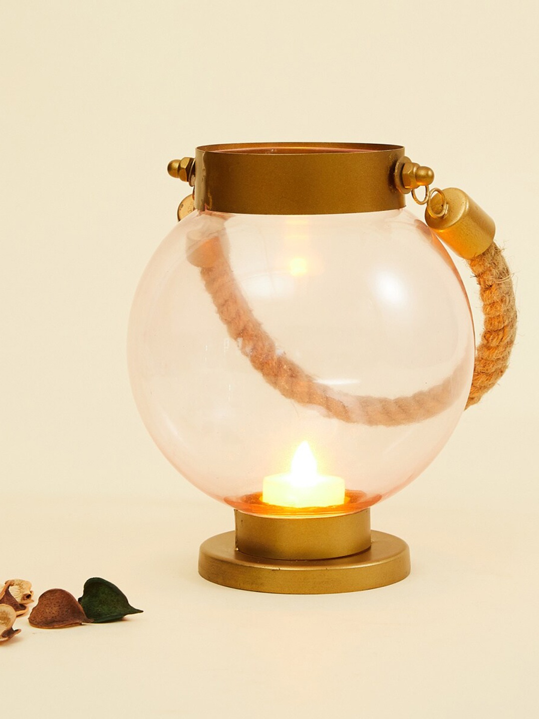 

Home Centre Gold-Toned Solid Glass Lantern With Jute Handle