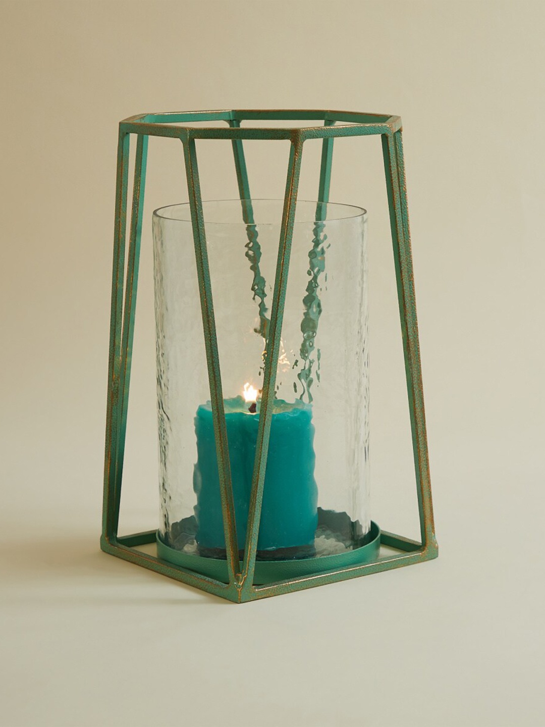 

Home Centre Teal Blue Solid Metal Cylindrical Candle Holder