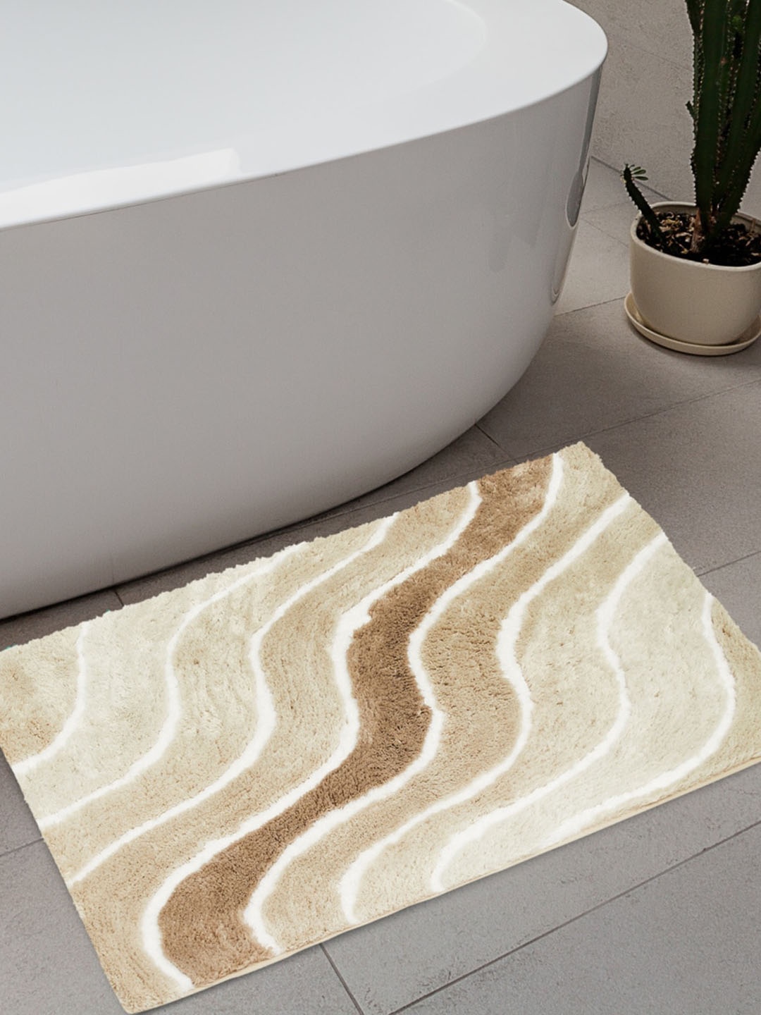 

Home Centre Beige & Brown Textured 1800 GSM Rectangle Bath Rug